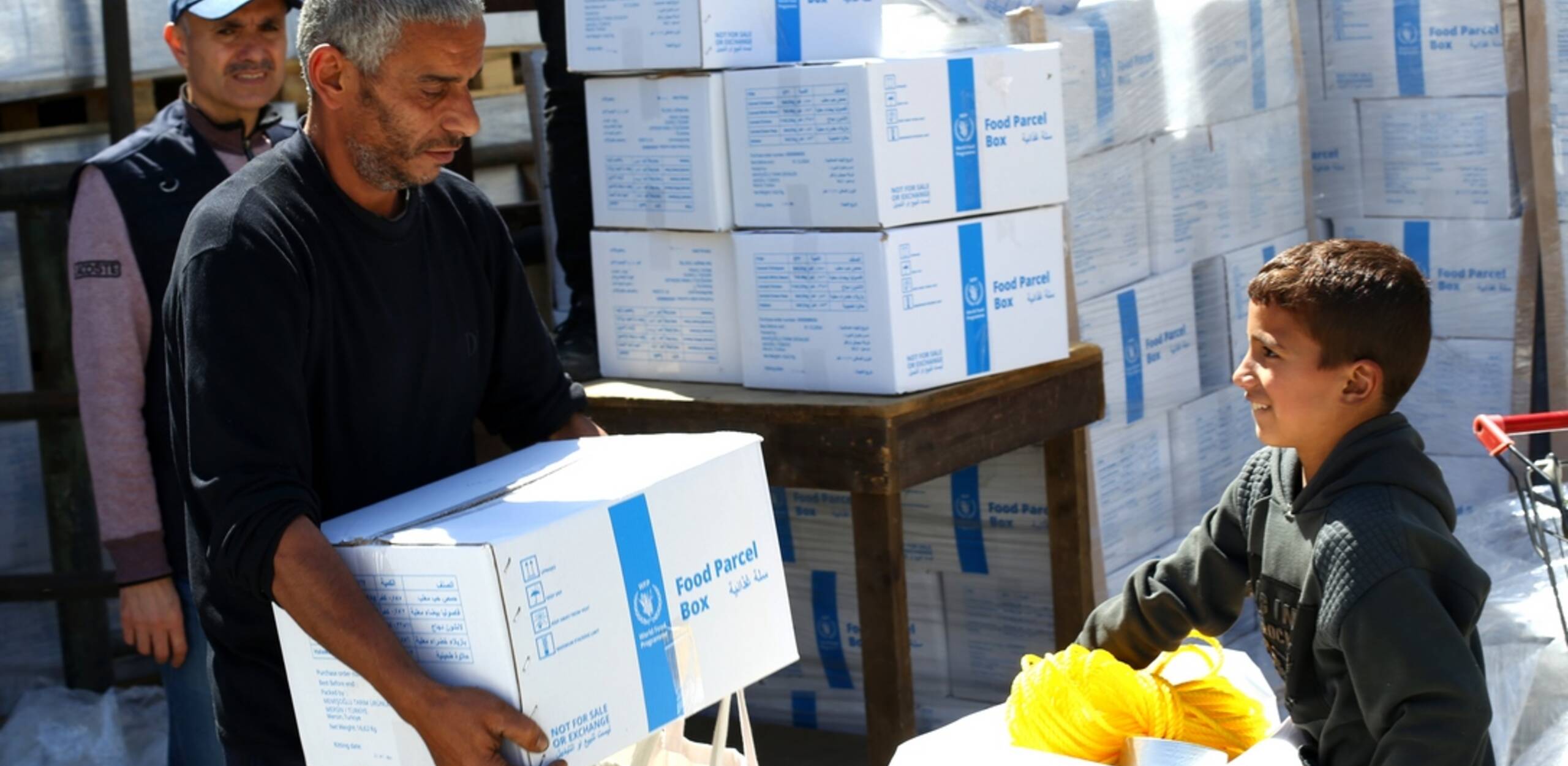 Families receive food and bedding in Gaza.