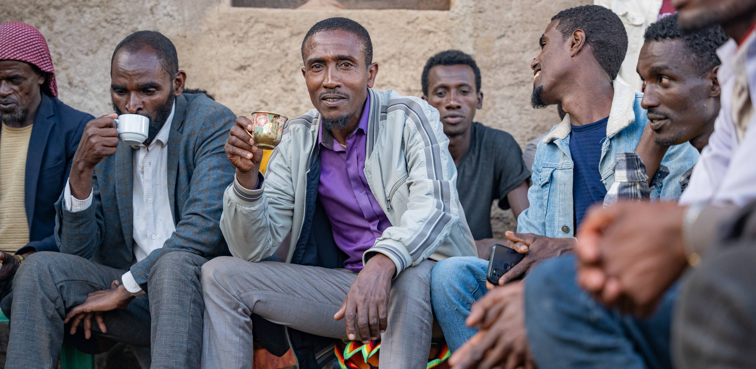 Men from Addis Ababa enjoy a cup of their coffee.