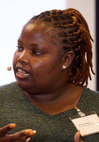 Winnie Cheche auf dem Podium des Caritas-Symposiums 2024