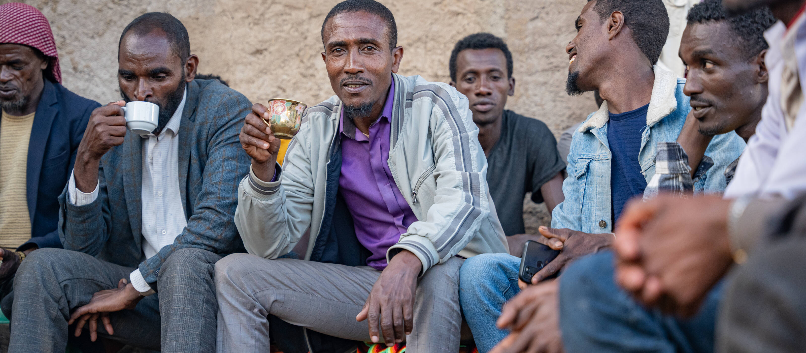 Men from Addis Ababa enjoy a cup of their coffee.