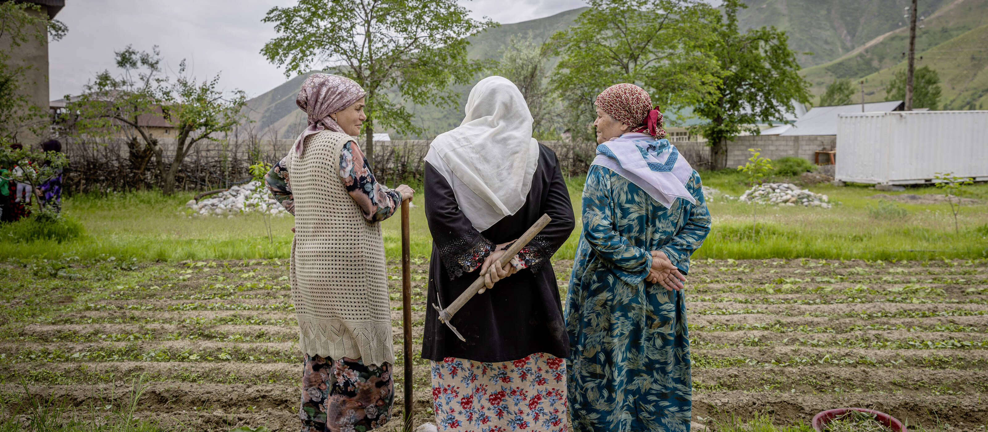 Ms. Gulrukhsor Nazimova (second from the left), 57 years old, is the leader of the "Faiz" women production group, locally helping with agriculture.