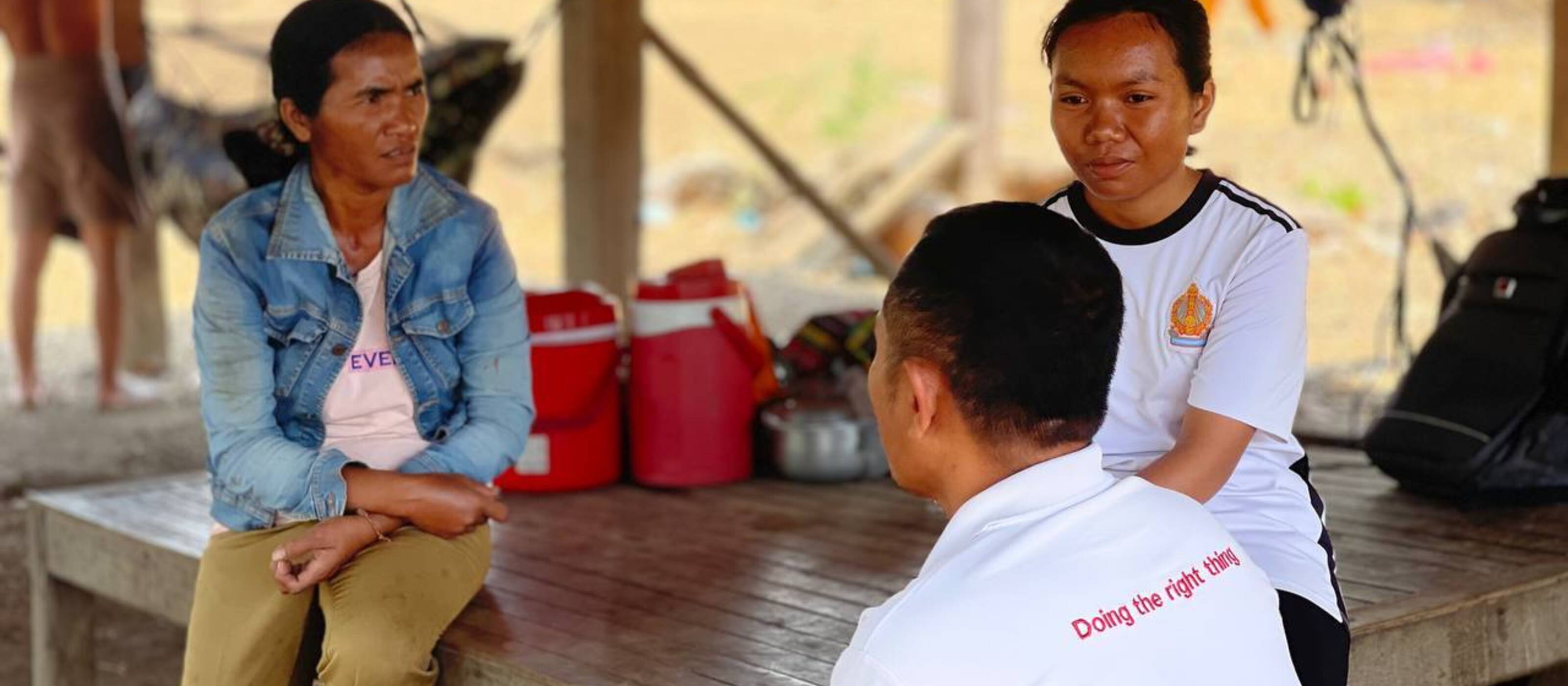 Two women of the community and one project employee of Caritas discussion in Cambodia