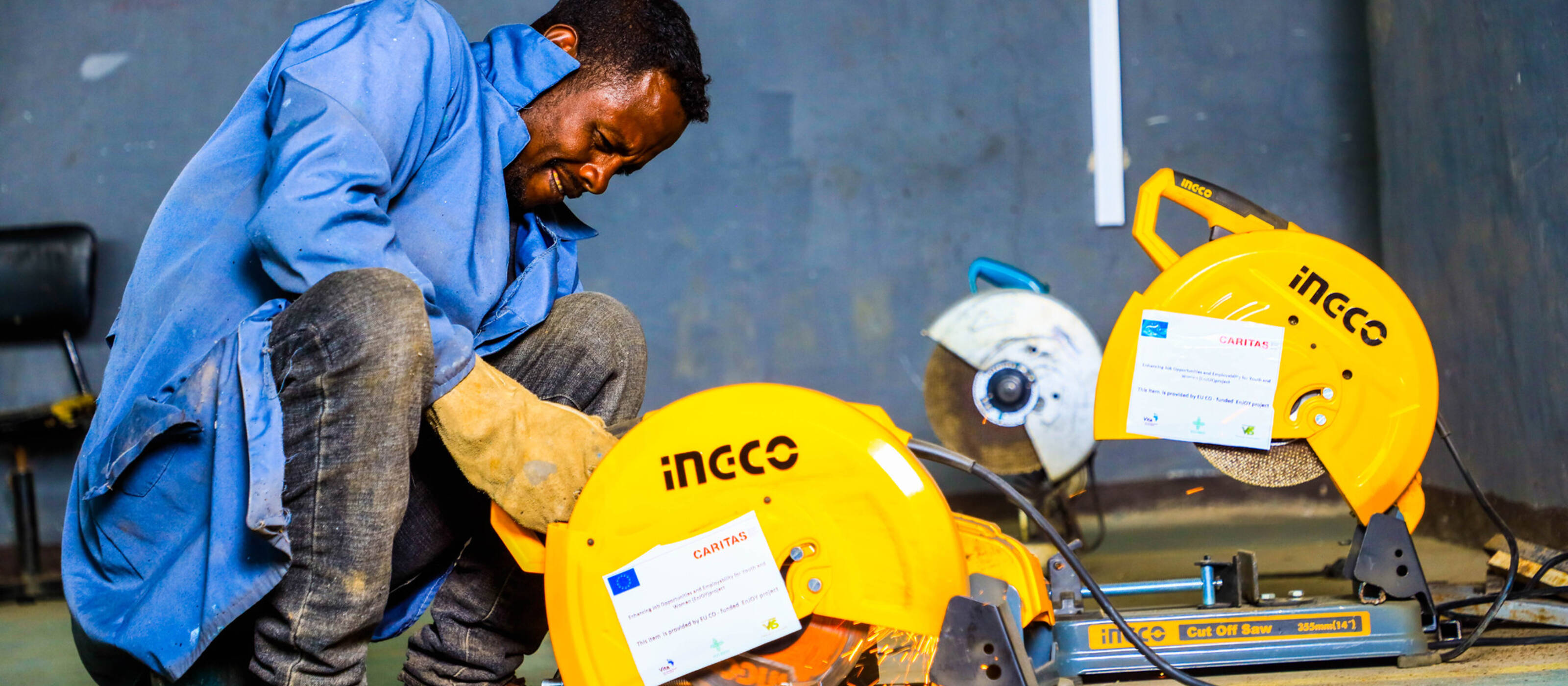 Project participant in Ethiopia with a machine