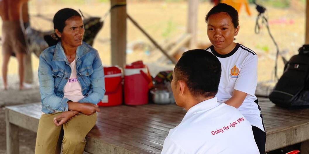 Two women of the community and one project employee of Caritas discussion in Cambodia