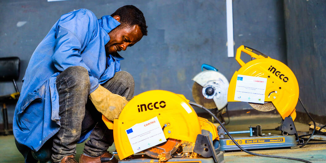 Project participant in Ethiopia with a machine